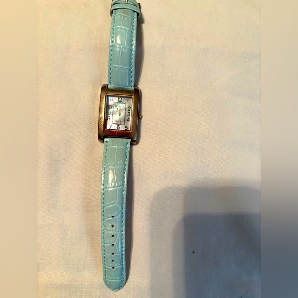 Like new light blue watch with mother-of-pearl face.